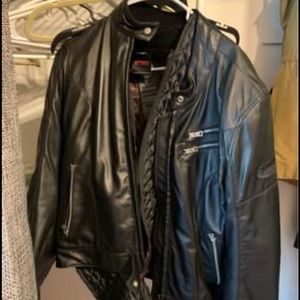 Never worn women’s motorcycle jacket. Premium black leather. Fits like a medium
